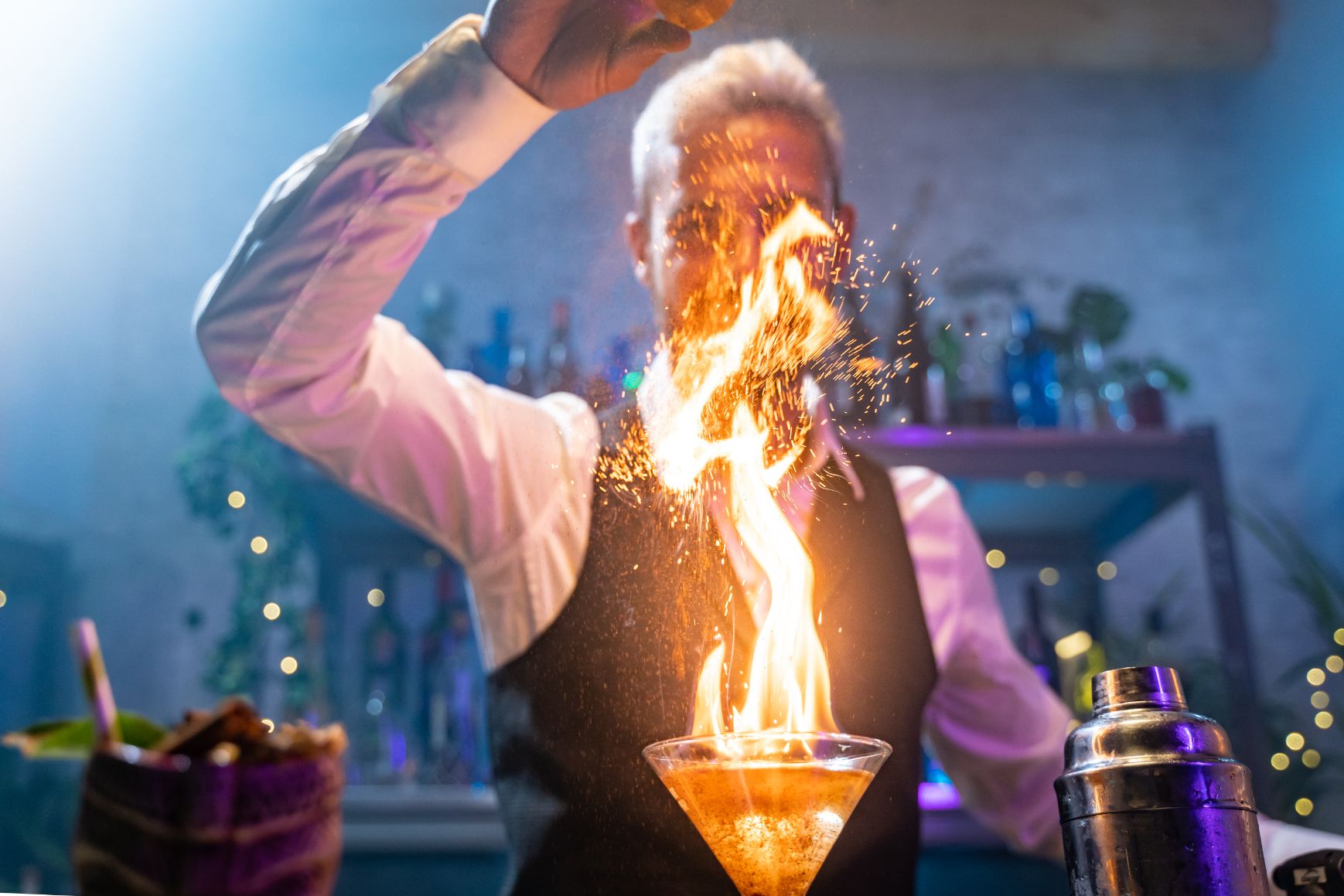 bartender-making-a-cocktail-with-fire-flame-unique-2022-11-11-03-19-06-utc